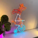 Animals Pets Neon Sign Giraffe Riding Bicycle 1